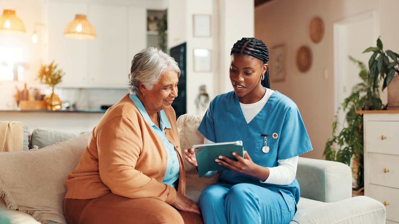 Nurse and patient observing a tablet